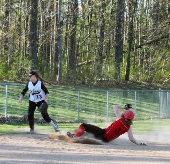 Megan Corson slides safely into third base. KATHY ONORATO/Wiscasset Newspaper