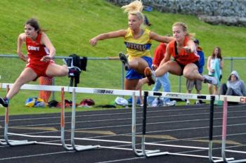 Morgan Crocker keeps up the intensity in the 100 meter hurdles. Courtesy of Aquilino Alamo