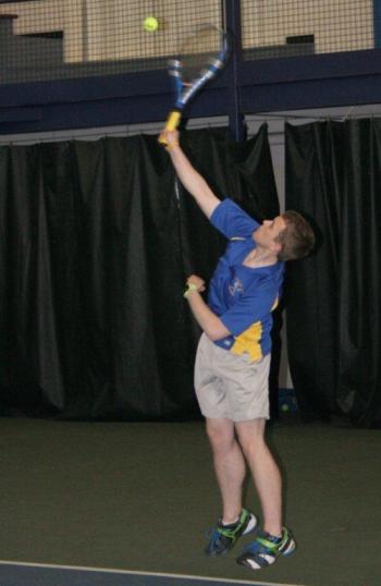 Second Doubles player Evan Stevens serves during the May 1 match against Spruce Mountain. KEVIN BURNHAM/Boothbay Register