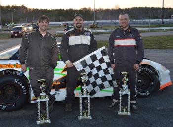 Josh Bailey of Wiscasset, center, holding the checkered flag, celebrates his first career win in the Super Stock race on May 4 at the Wiscasset Speedway. Adam Chadbourn of Woolwich, left, took third and Bobby Mesimer of Wiscasset, right, took second place. Courtesy of Peter Taylor, Wiscasset Raceway