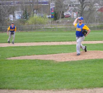 Nate Colcord, right, fires a pitch in the third inning May 15 against the Wiscasset Wolverines as Stephen Barter gets ready (left). Colcord drove in one run, but Wiscasset came away with a 12-2 victory. Below: Wiscasset's Chandler Longfellow fires a pitch. BEN BULKELEY/Boothbay Register