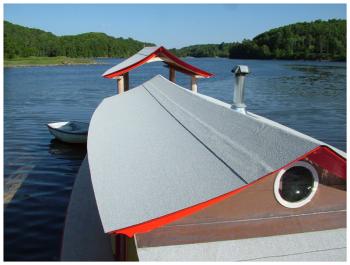 A view across the asphalt roll roof of Shanty's cabin, looking south down the Passy. (Photo by Ethan Andrews)