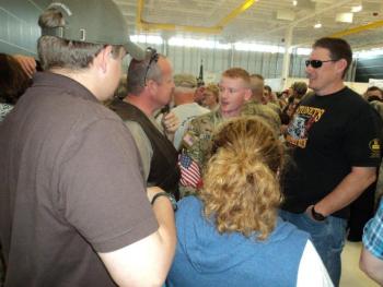 Pvt. Mason Leighton talks with his father, Micheal Leighton, and family friend, Patrick Higgins. Courtesy of Isaac Luken