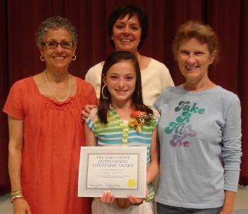 Emily Harris is surrounded by, from left, Madeline Olney (guidance counselor), Lisa Clarke (principal) and Carol Leone (mother of the late Sara Leone). Courtesy of Edgecomb Eddy School