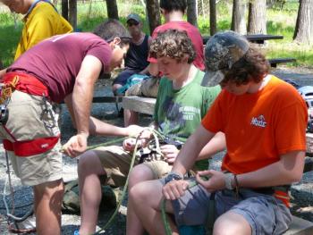 Jake and Sherm Brewer receive instruction from Acadia Guides Climbing School instructor, Dick Chasse. Courtesy of Sarah Sherman McGrail