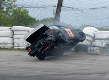 Nate Tribett's #13 car hits the wall in the Mini Outlaw division’s lap 21 on Saturday, June 8 at the Wiscasset Speedway. Courtesy of Peter Taylor, Wiscasset Speedway