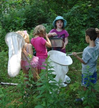 Children discovering nature’s creepy crawlies while participating in BRLT’S environmental education program, the Osprey Program.  The land trust is raising money to sustain its education program, which it provides for partner programs, such as Y’s Camp Knickerbocker, and to the community at large. Courtesy of BRLT