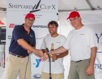 Hodgdon Yachts CEO Tim Hodgdon, left, congratulates representatives from the Scheherezade after the boat won the 2012 Shipyard Cup. Courtesy of Billy Black