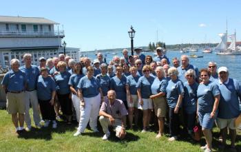 The 14th Biennial Island Packet Rendezvous took place in Boothbay Harbor from July 25-28 at Captain Fish’s and Boothbay Harbor Inns. The Island Packet crew, with Mary and Norm Pierce at center front, took a break for a group photograph on Saturday, staged in front of their yachts of choice anchored in the background.  SUE MELLO/Boothbay Register