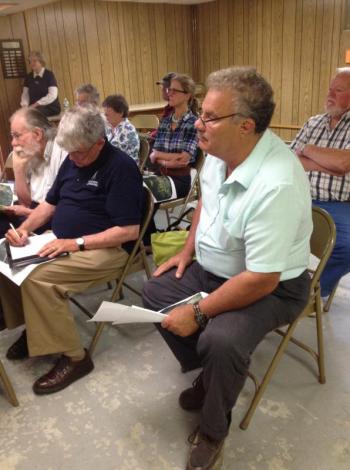 Consultant Karl Olson, left, takes notes as his client, developer Tony Casella, listens during a meeting in Edgecomb July 3. SUSAN JOHNS/Wiscasset Newspaper