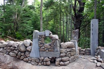 Even without its final touches in place, this stone wall by Joe Norton gives a glimpse of what's to come when the shorefront Fairy House Village reopens on August 24 at Coastal Maine Botanical Gardens. Courtesy of Barbara Freeman