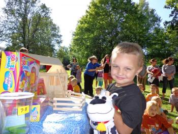 Peter wins a toy barn donated by Big Al’s. Courtesy of Wiscasset Public Library