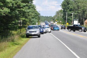 Lincoln County Sheriff’s Office directs traffic near Montsweag Flea Market on Route 1 Wednesday following a car chase. Two people suspected of a Knox County home robbery were arrested by Lincoln County Sheriff’s Office. BEN BULKELEY/Boothbay Register