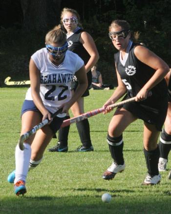 Boothbay senior co-captain Brooke Alley pushes the ball past a St. Dom’s player during Friday’s home game at Perkins Field. KEVIN BURNHAM/Boothbay Register