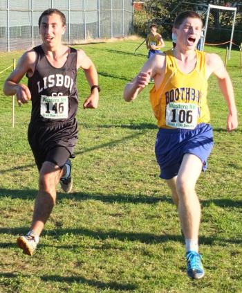 Kyler Carty screams in for a photo finish at Boothbay's home meet on September 18. Carty bested his opponent by a tenth of a second. RYAN LEIGHTON/ Boothbay Register