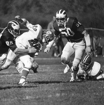 Gary “Mad Stork” Dow (#50), Maine Black Bears ('72-'75) moves in to assist Scott Shulman with a tackle against Boston University in 1975.