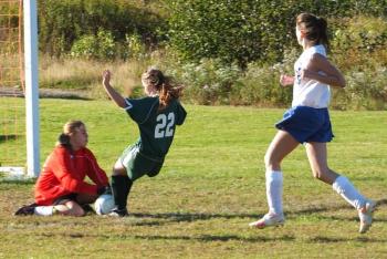 Goalie Jamie Wheeler scoops up the ball from a Carrabec striker during the home game on October 1. Wheeler had 19 saves. RYAN LEIGHTON/Boothbay Register