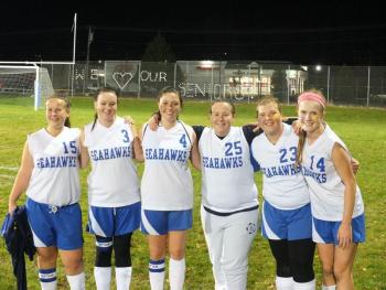 A happy ending for the Lady Seahawks, who celebrated their final game of the season with a win over Winthrop on October 21. From left are seniors Dana Greenleaf, Ashley Poland, Hannah Winslow, Evie Greenleaf, and underclassmen Brenna Alley and Sinead Miller. RYAN LEIGHTON/Boothbay Register