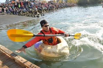 Tim Smith reaches out to grab the dock and win his heat during Monday’s pumpkin regatta in Damariscotta. Smith, from Boston, won his fifth title. BEN BULKELEY/Boothbay Register