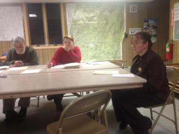 Edgecomb Selectmen’s Chairman Jack Sarmanian, left, Selectman Jessica Chubbuck and Realtor Lisa Kalloch pause for a resident’s question November 4. Kalloch proposed the town take a cemetery on Old County Road to help her church in Chelsea find a buyer for a church on that road. SUSAN JOHNS/Wiscasset Newspaper