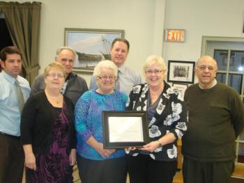 Scholarship fund representatives accept award