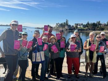 A group of people show of their copies of Love & Lobsters