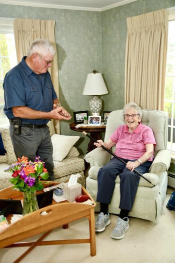 Selectman Gerry Gamage presents Evelyn Luther Pratt Sherman with the Boston Post Cane. Robert Mitchell photo 