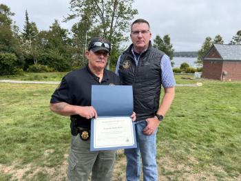 DMR Manager of the Year, Marine Patrol Sergeant Mark Murry, left, with Commissioner Patrick Keliher. Courtesy of DMR