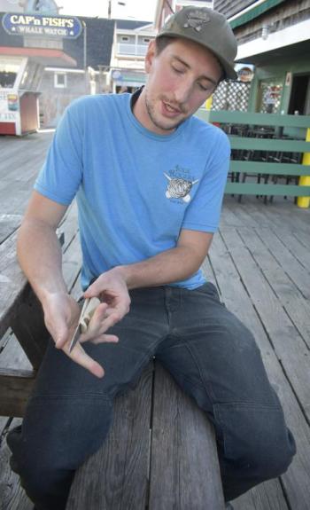 The shucking contest winner shows off his knife. 