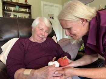 Caregiver Kim Greene-Labranche interacts with Ginny Cardner at her home in Gorham.