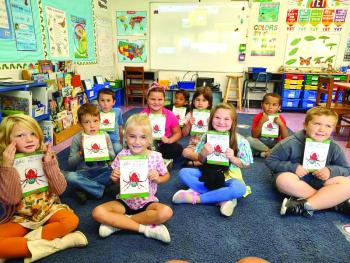 First graders with new books 