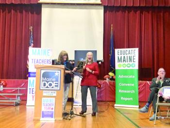 Maine Education Commissioner Pender Makin hands Hallowell the award for Maine Teacher of the Year. SUSAN JOHNS/Wiscasset Newspaper 