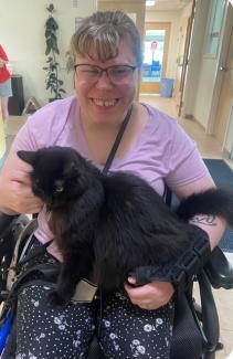 Savannah Robinson with a feline at Pope Memorial Animal Shelter in Thomaston.