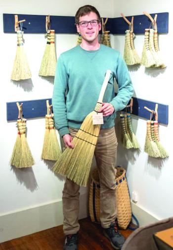 Holding a broom 