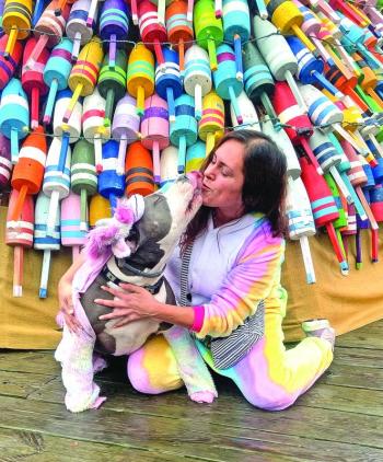 Expressing love during the Early Bird Sale in front of the Buoy Tree. STEVE EDWARDS/Boothbay Register