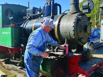 Engineer John Orne works on the train at the Boothbay Railway Village Museum. ISABELLE CURTIS/Boothbay Register