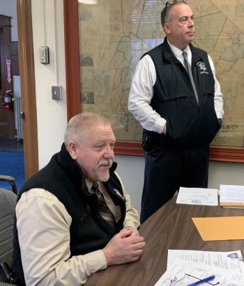 Sheriff Todd Brackett, seated, sought commissioner approval Jan. 7 on shellfish and animal control contract renewals. Standing is Chief Deputy Rand Maker. BILL PEARSON/Boothbay Register