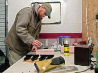 Joe Mathiau of Lincolnville pours plastic resin for hotel door lock covers at the Morrill headquarters of Sure Tech Industries. Security upgrades in the hospitality industry, and more recently the Sandy Hook Elementary School shootings, have given the lock business got an unexpected boost. (Photo by Ethan Andrews)