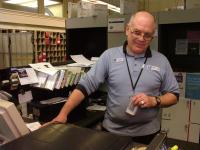 Steve Clark, a familiar face behind the counter at the Belfast Post Office, is retiring this week after 28 years at the branch. (Photo by Ethan Andrews)