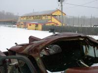 A smashed and rusted car outside the Unity Raceway grandstands on March 4. The track closed last August due to financial troubles but was recently leased by Last Chance Motorsports. The Washburn-based company plans to reopen the track in May. (Photo by Ethan Andrews)