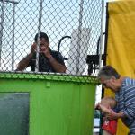 Deputy Chief Alex Gaylor and a young ball roller both wipe their eyes after a big splash. (Photo by Sarah Thompson)