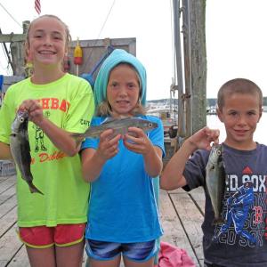 Sydney, Courtney and Drew Meader hold their winning pollock. Courtesy of Steve Rubicam