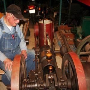 Robert Meixell, a collector of antique farm engines and co-founder of the Maine Antique Power Association, restores engines from his Westport Island homestead. JOHN MAGUIRE/Wiscasset Newspaper