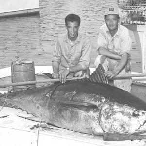 Bob Damrell and Pat Elderkin on a dock in Boothbay Harbor with a tuna they caught in 1963. Courtesy of June Elderkin