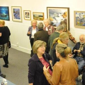 A crowd gathers Saturday at the third annual ArtinMe event at the Boothbay Region Art Foundation. Bremen's Claire Hancock won best in show for her painting titled “Pink 'Knock-Out' Roses.”  The event will be on display until November 3. BEN BULKELEY/Boothbay Register