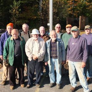 The busy workers of the Woodchucks briefly halt operations for a photo. The all-volunteer service group made up of local retirees work year-round to provide wood used to heat the homes of families in need. Pictured back row left are, Leo Barter Sr., Denny Wilson, Greg Holton, Ham Meserve, Maurice Landemare and Bill Smith. Front Row left, John King, Henry C. Rowe, Barclay Shepard and Doug Fowle. RYAN LEIGHTON/Boothbay Register