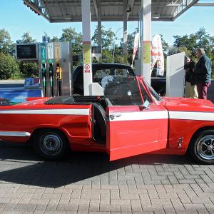 Bruno and Cécile's red, roofless '65 Triumph Vitesse.