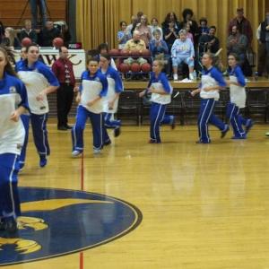 The Lady Seahawks make their entrance into Porter Memorial Gymnasium led by senior captain Sarah Caron.  