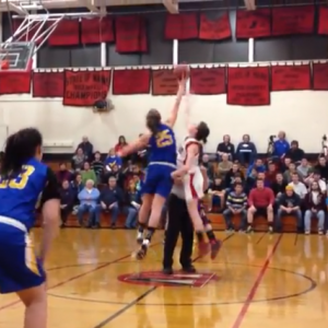 Alex Clarke tips off against Wiscasset's center. Boothbay beat their rivals 55-28, January 7