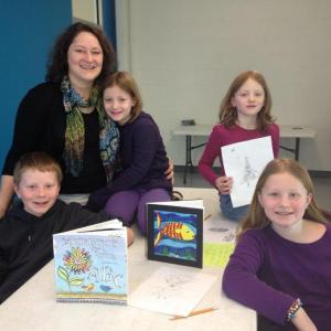 Eason's children, from left, Alex, 11; twins Mia and Callan, seven, Zoë, nine, and Carrie above in the upstairs Community Room where classes will be held. LISA KRISTOFF/Boothbay Register